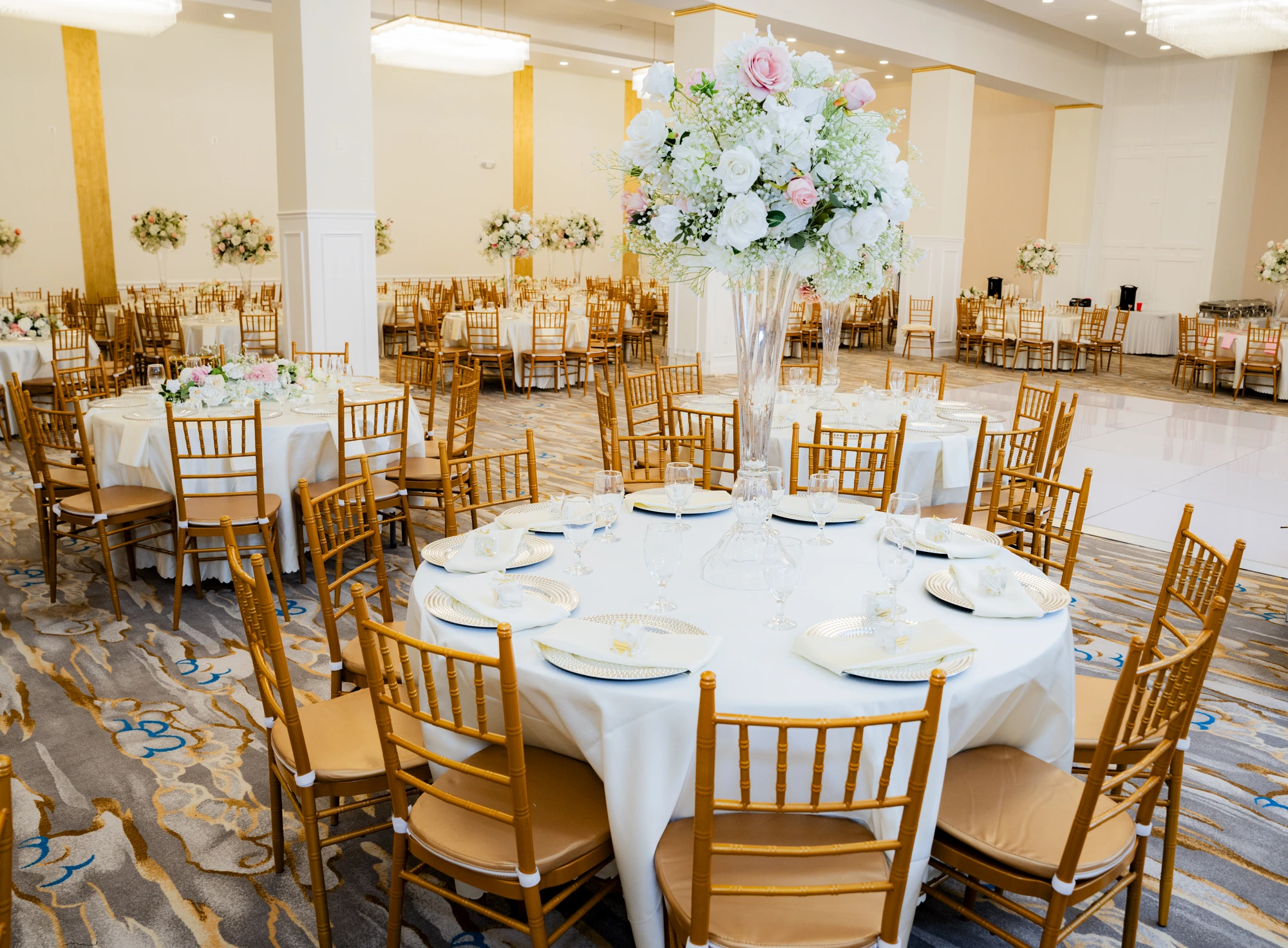 Ballroom styled with tall floral centerpieces